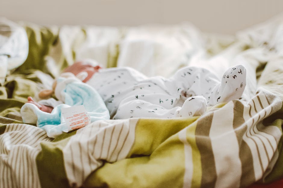 A well-organized nursery featuring a changing table with storage, a comfortable rocking chair, and multi-functional furniture pieces.